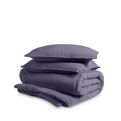 Washed duvet cover and sham set folded and stacked on a white background