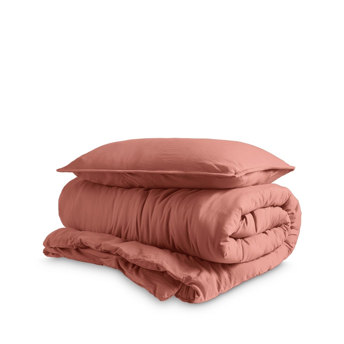 Washed duvet cover and sham set folded and stacked on a white background