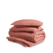 Washed duvet cover and sham set folded and stacked on a white background