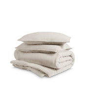 Washed duvet cover and sham set folded and stacked on a white background