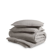 Washed duvet cover and sham set folded and stacked on a white background