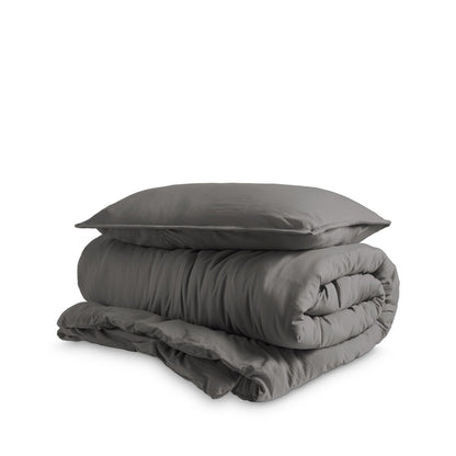 Washed duvet cover and sham set folded and stacked on a white background