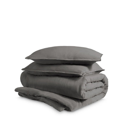 Washed duvet cover and sham set folded and stacked on a white background
