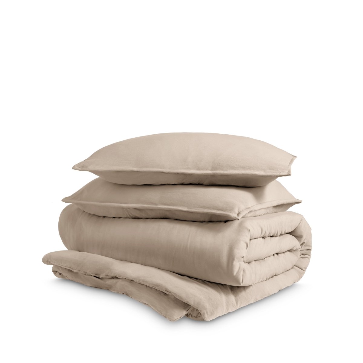 Washed duvet cover and sham set folded and stacked on a white background