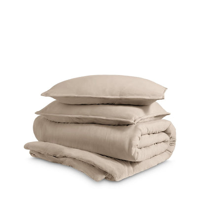 Washed duvet cover and sham set folded and stacked on a white background