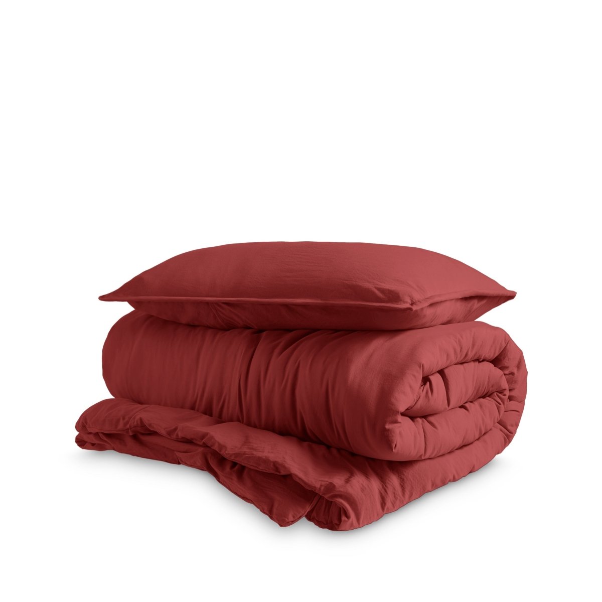 Washed duvet cover and sham set folded and stacked on a white background