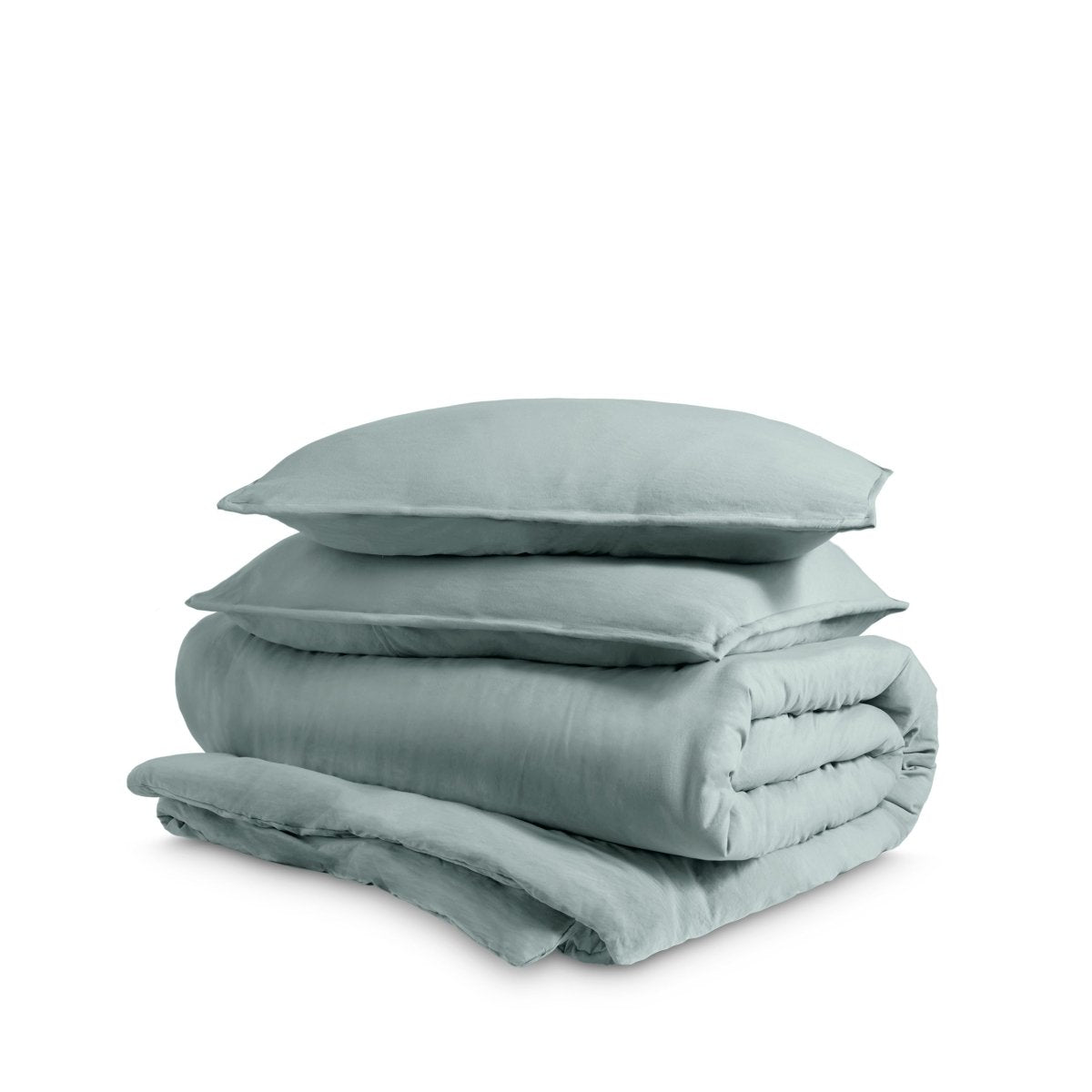 Washed duvet cover and sham set folded and stacked on a white background