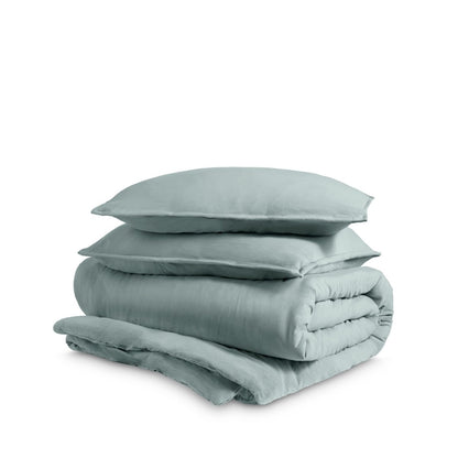Washed duvet cover and sham set folded and stacked on a white background