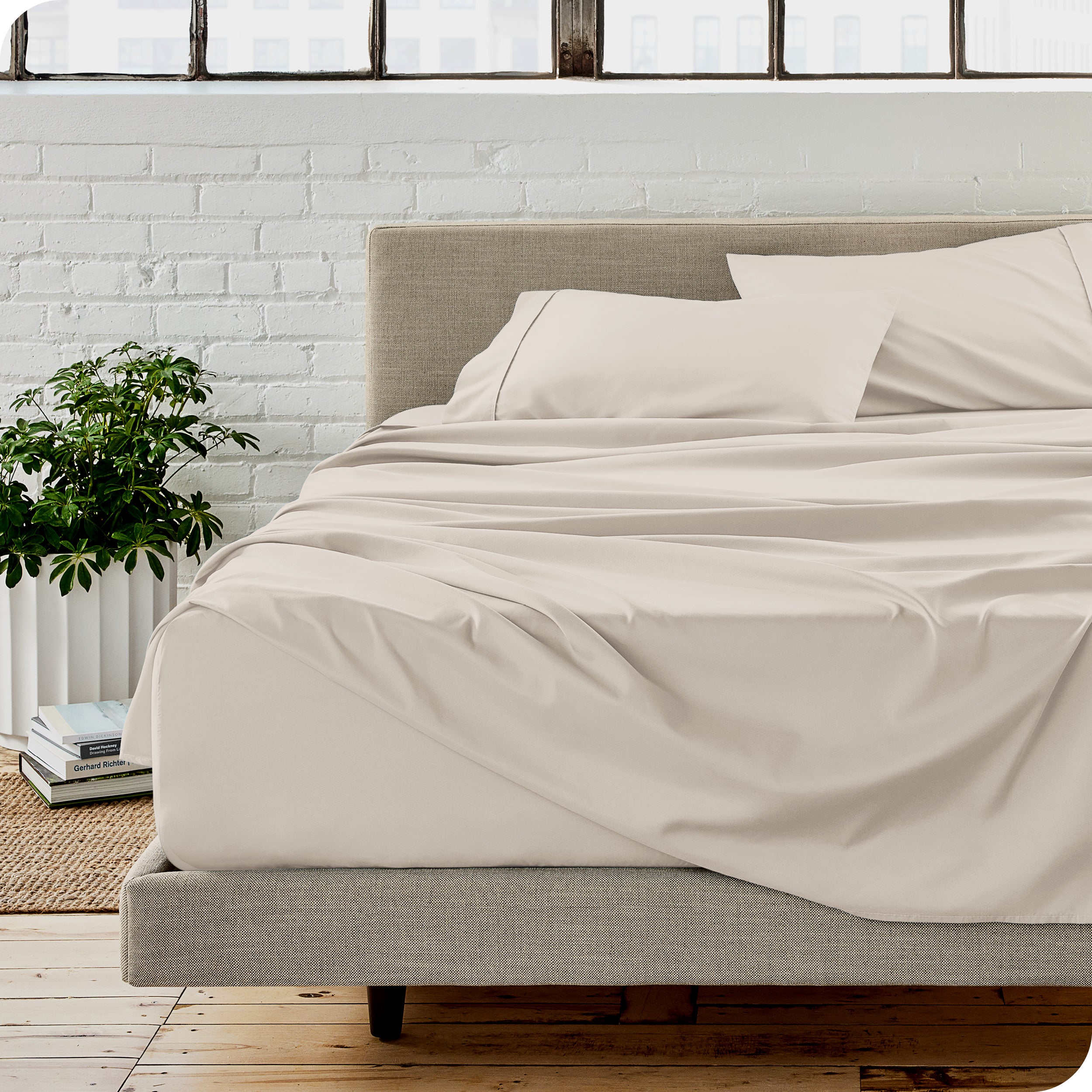 A modern bedroom with microfiber sheets on the mattress