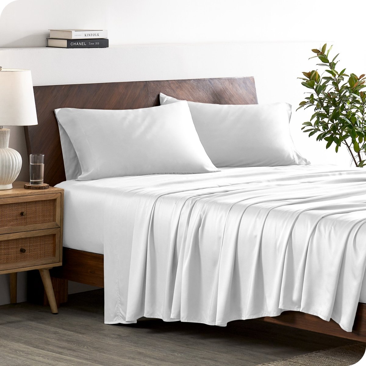 A stylish bed with bamboo sheets and pillowcases, showcasing a sophisticated and elegant bedroom setting.