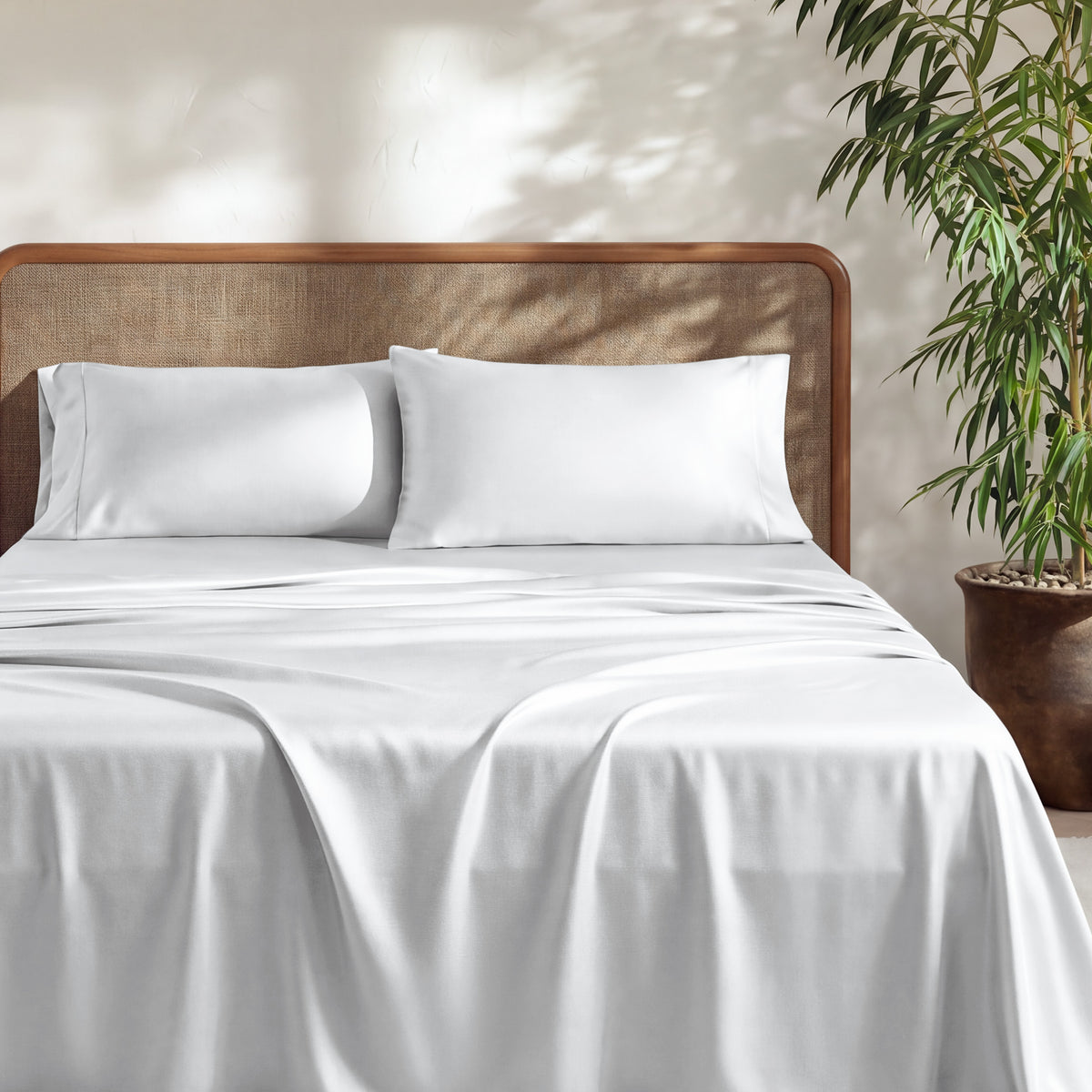 A bed with bamboo sheets on it. 
