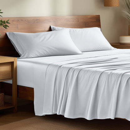 Bamboo bed sheets on a bed in a bedroom with night stands.