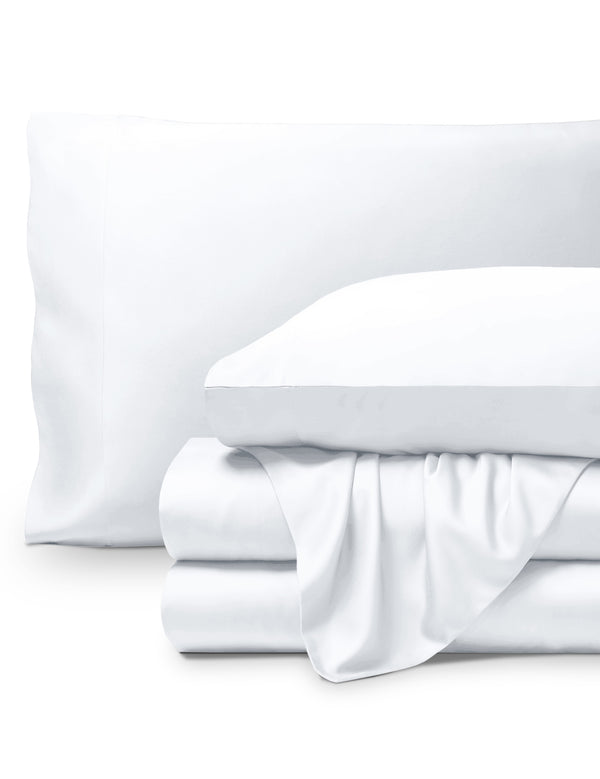 Bamboo pillowcases and sheets set on a white background
