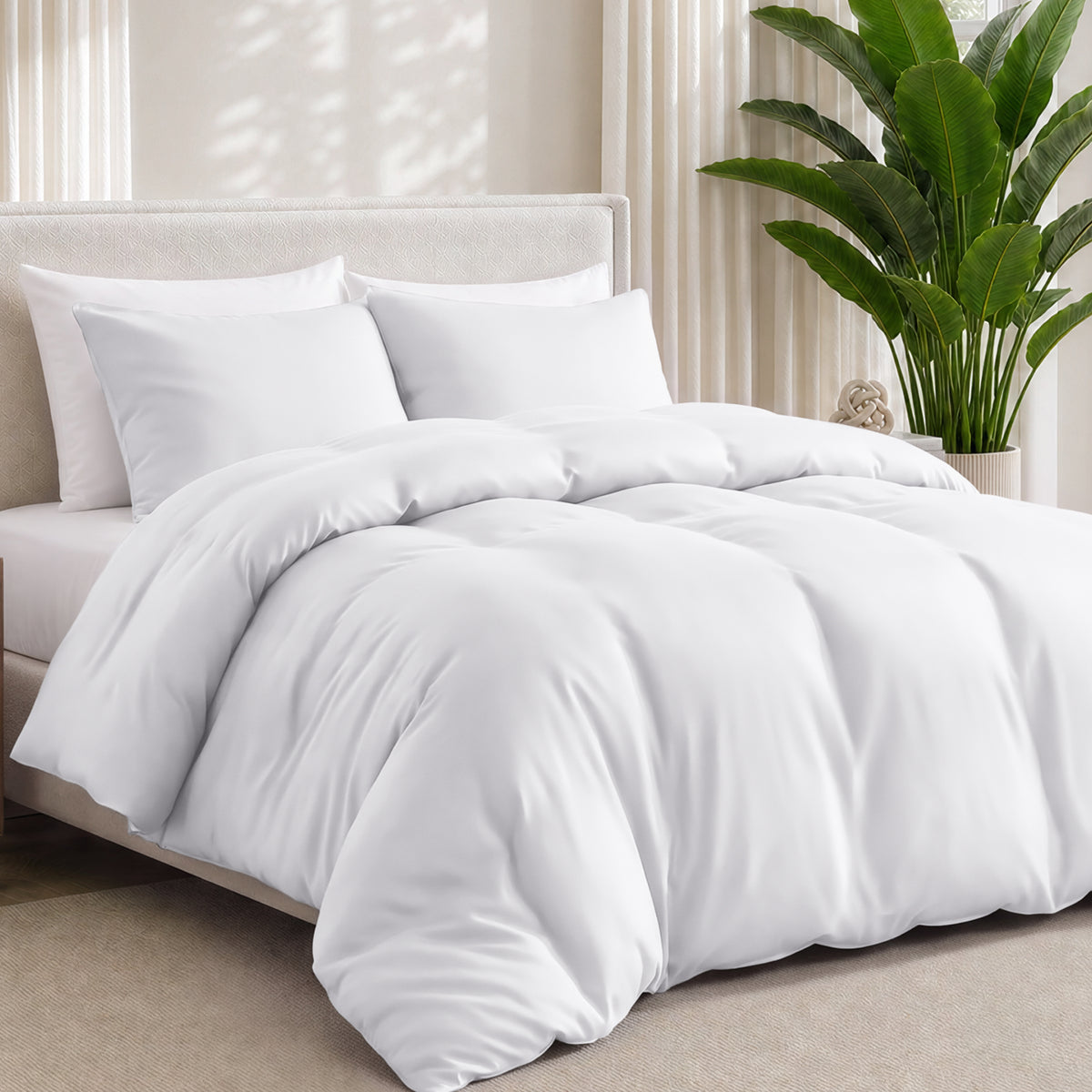 Bamboo bedding set on a bed in a bedroom with a plant in the corner.