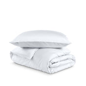 Bedding set with duvet cover and pillow shams on a white background