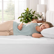 A woman sleeping on a bed