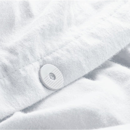Close up of the button closure on a flannel duvet cover