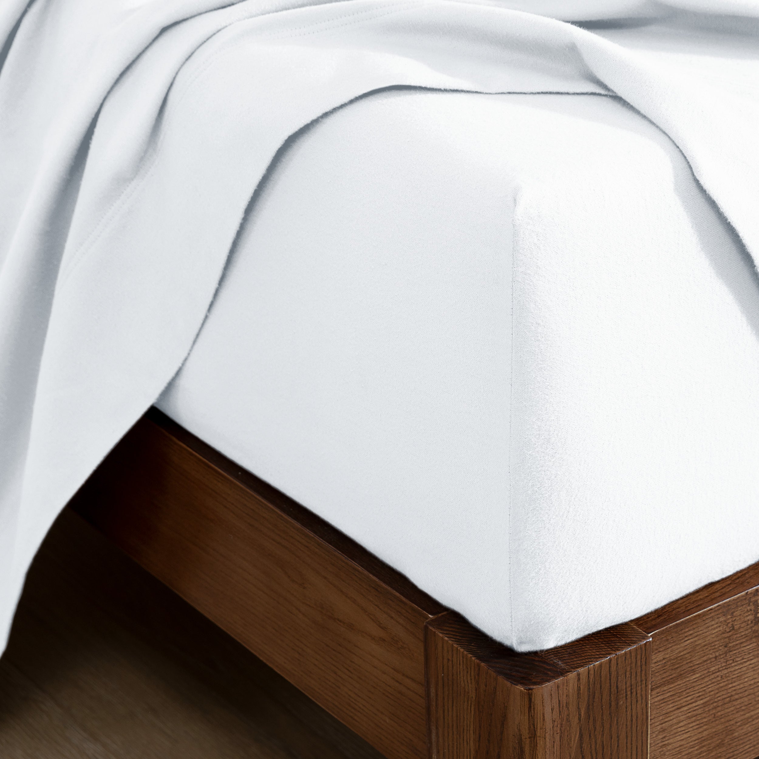 Flannel fitted sheet on a wooden bed frame