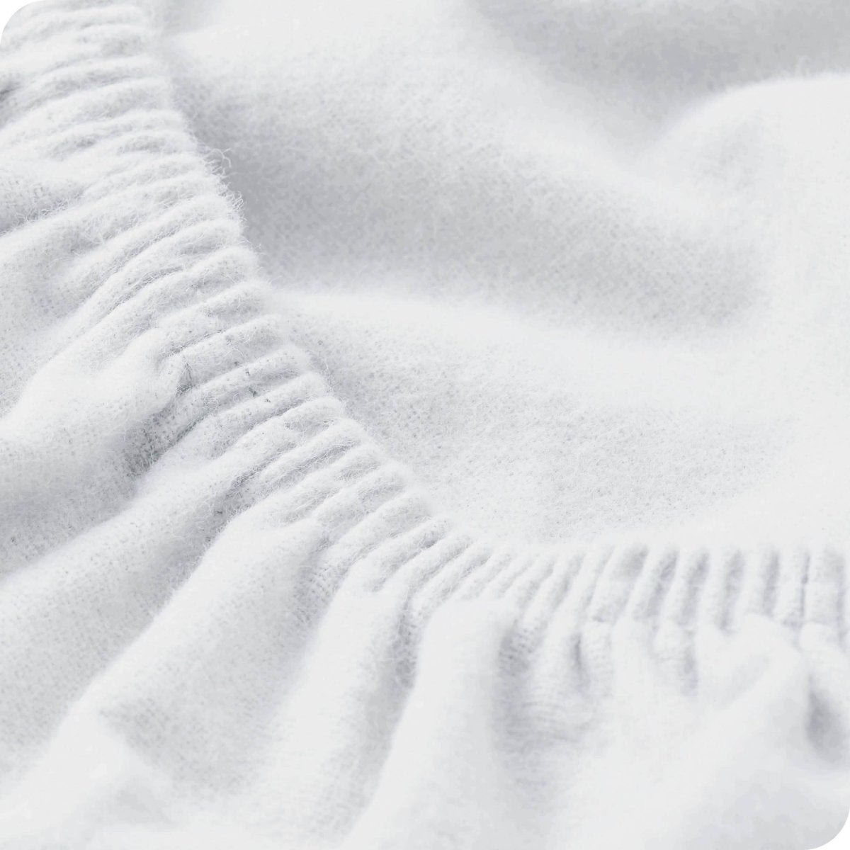 Close up of the elastic portion of a flannel fitted sheet