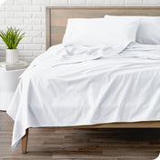 A modern bed with a flannel sheet set on