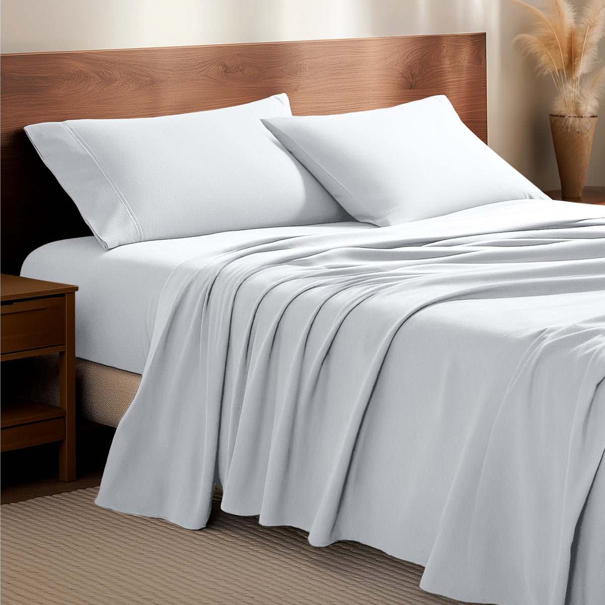 Flannel bedding set on a bed with a wooden headboard and side table