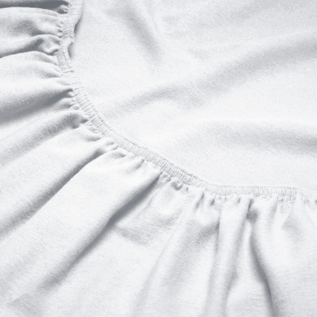 Close-up of a flannel fitted sheet with gathered elastic