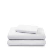 Cotton flannel sheet set folded and stacked on a white background