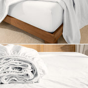 Fitted sheet on a wooden bed frame and folded fitted sheet.