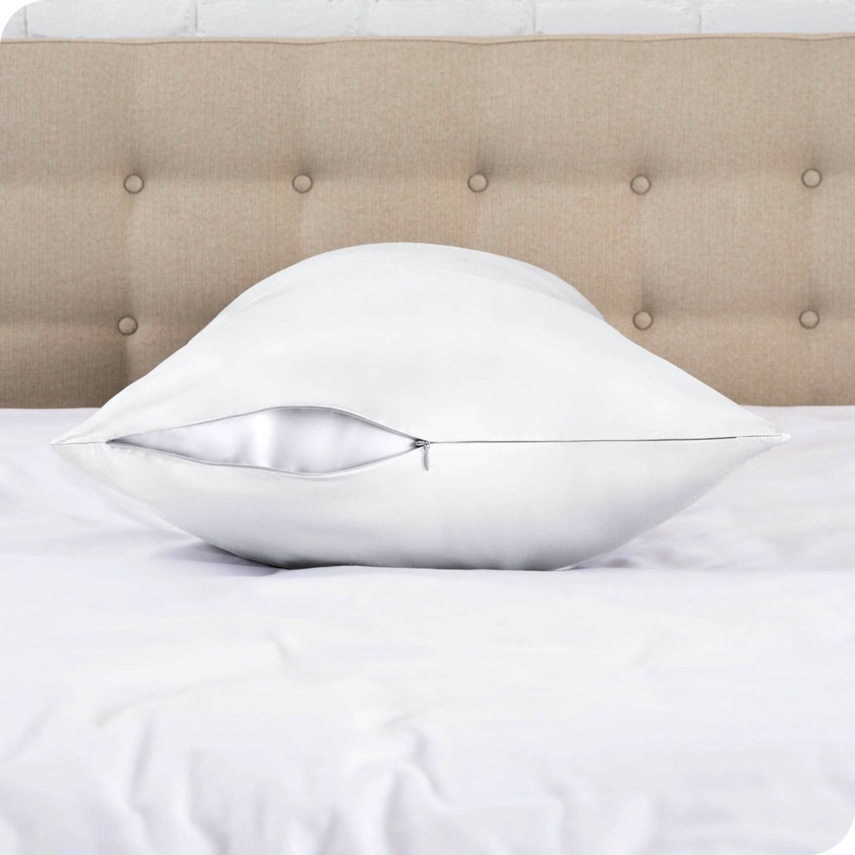 The zipper closure on a silk body pillowcase