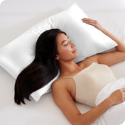 A woman sleeping with her head on a silk pillowcase