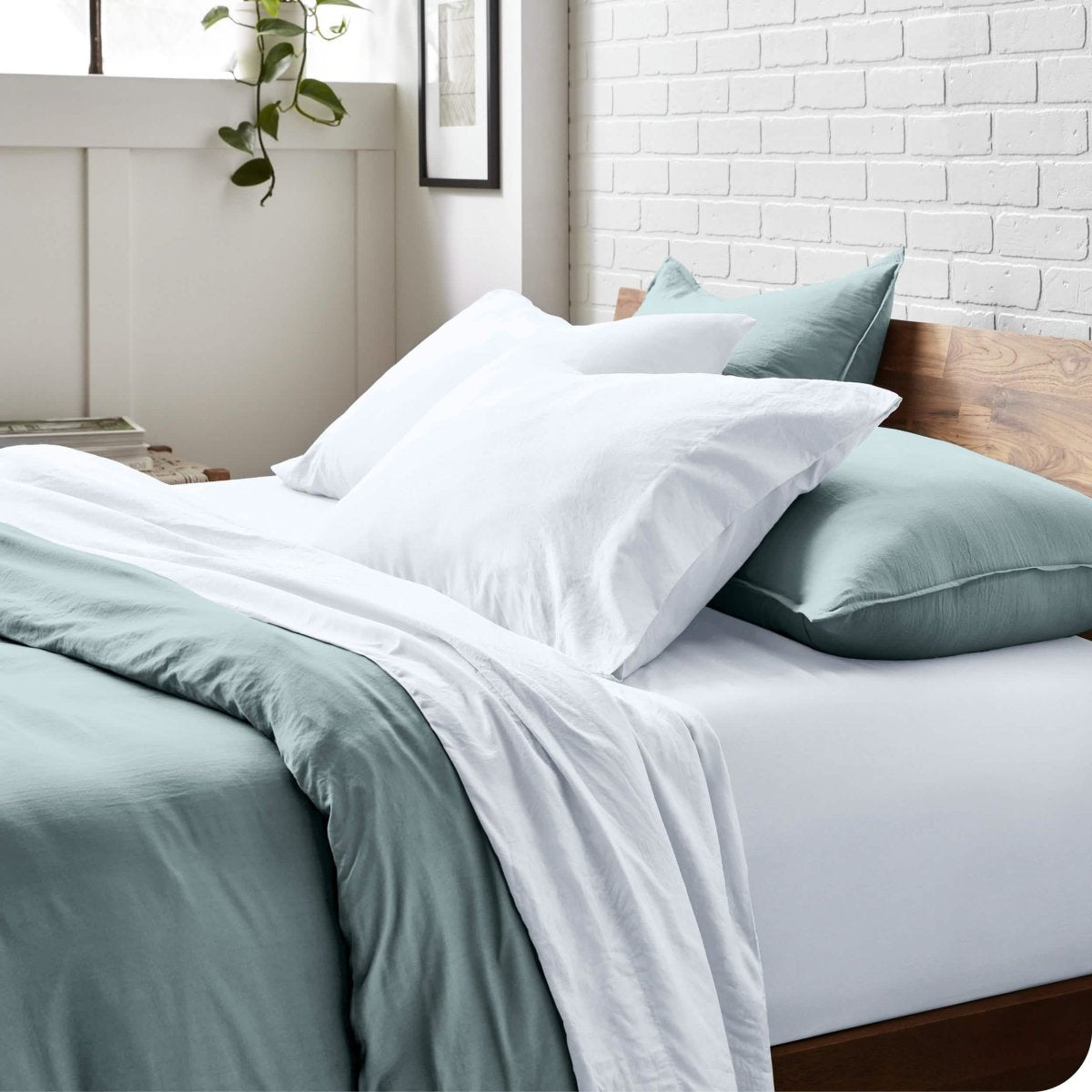 Modern bedroom with washed sheets and duvet cover on a bed