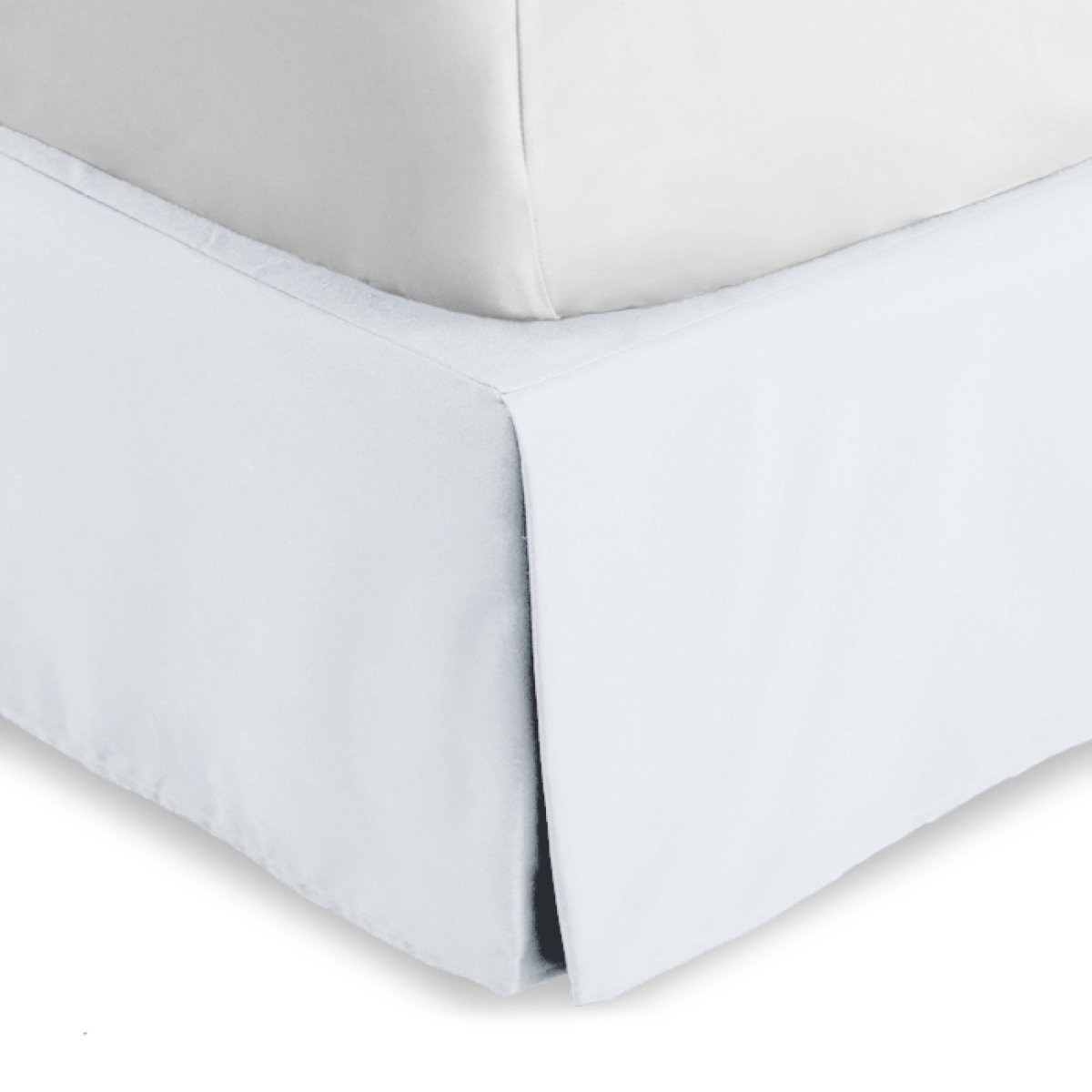 Bed skirt on a bed with white bedding