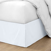 Ultra soft bed skirt on a bed with white bedding.
