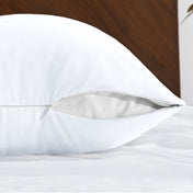 Body pillowcase with a zipper closure on a bed with a wooden headboard
