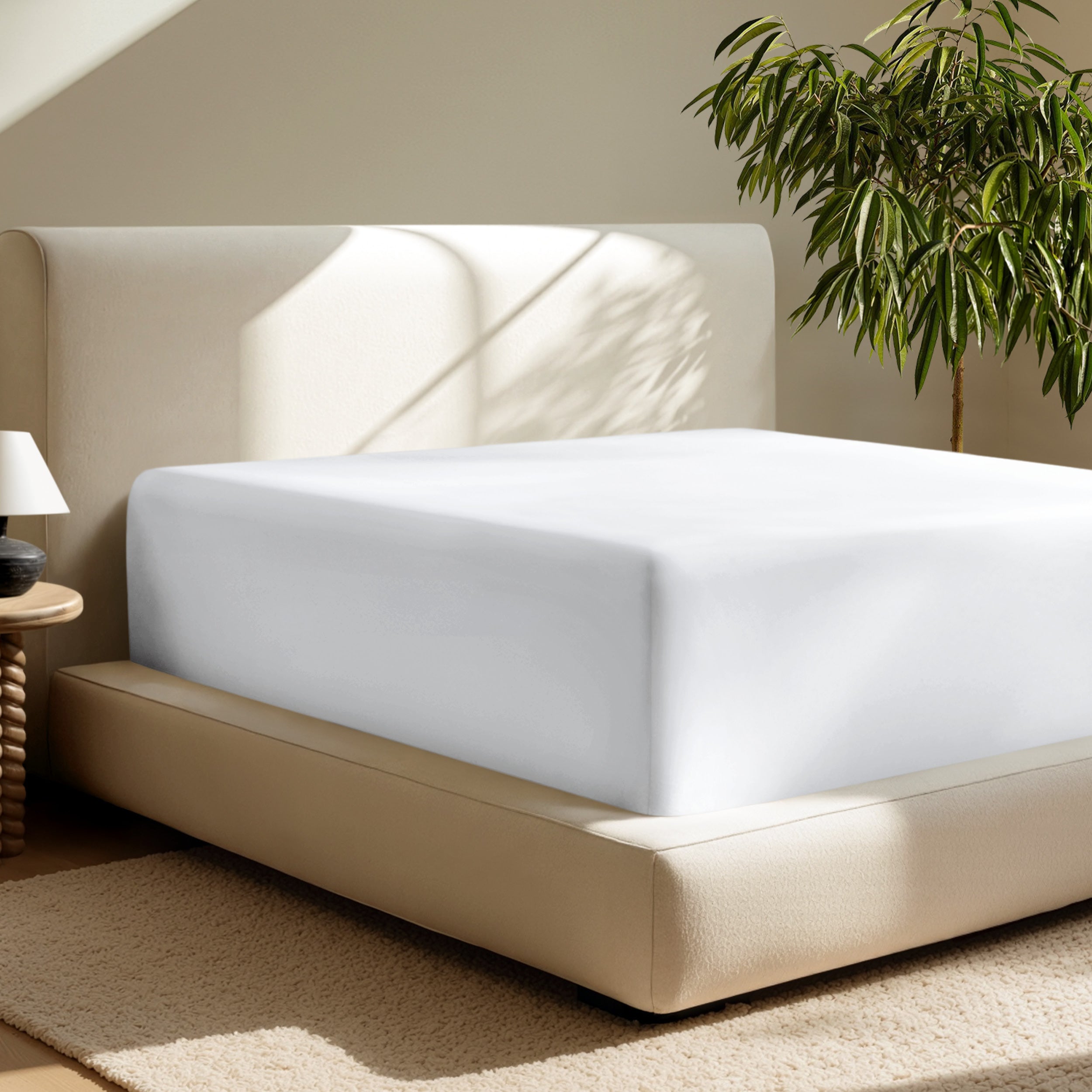 A deep pocket fitted sheet on a mattress