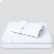 A microfiber sheet set folded and stacked neatly