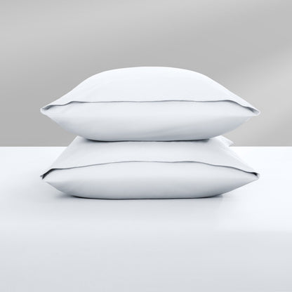 Two pillowcases on top of a bed