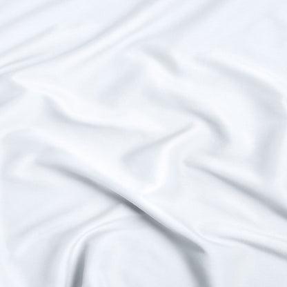 A close-up of ultra soft sheet fabric with soft folds and a smooth texture