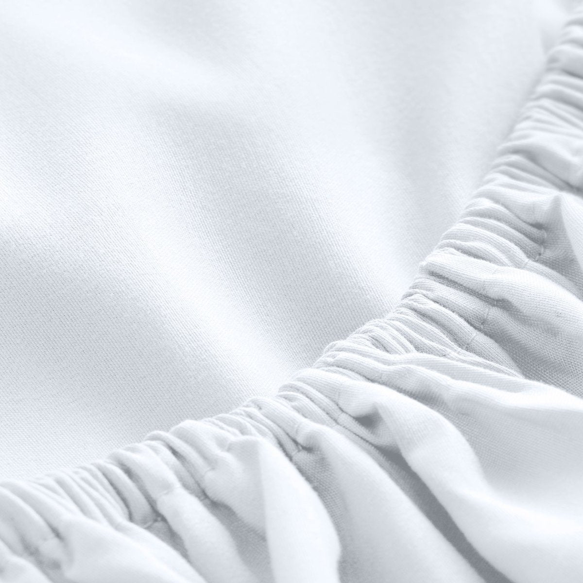 Close-up of fitted sheet showing the all around elastic