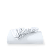 White fitted sheet on a white background