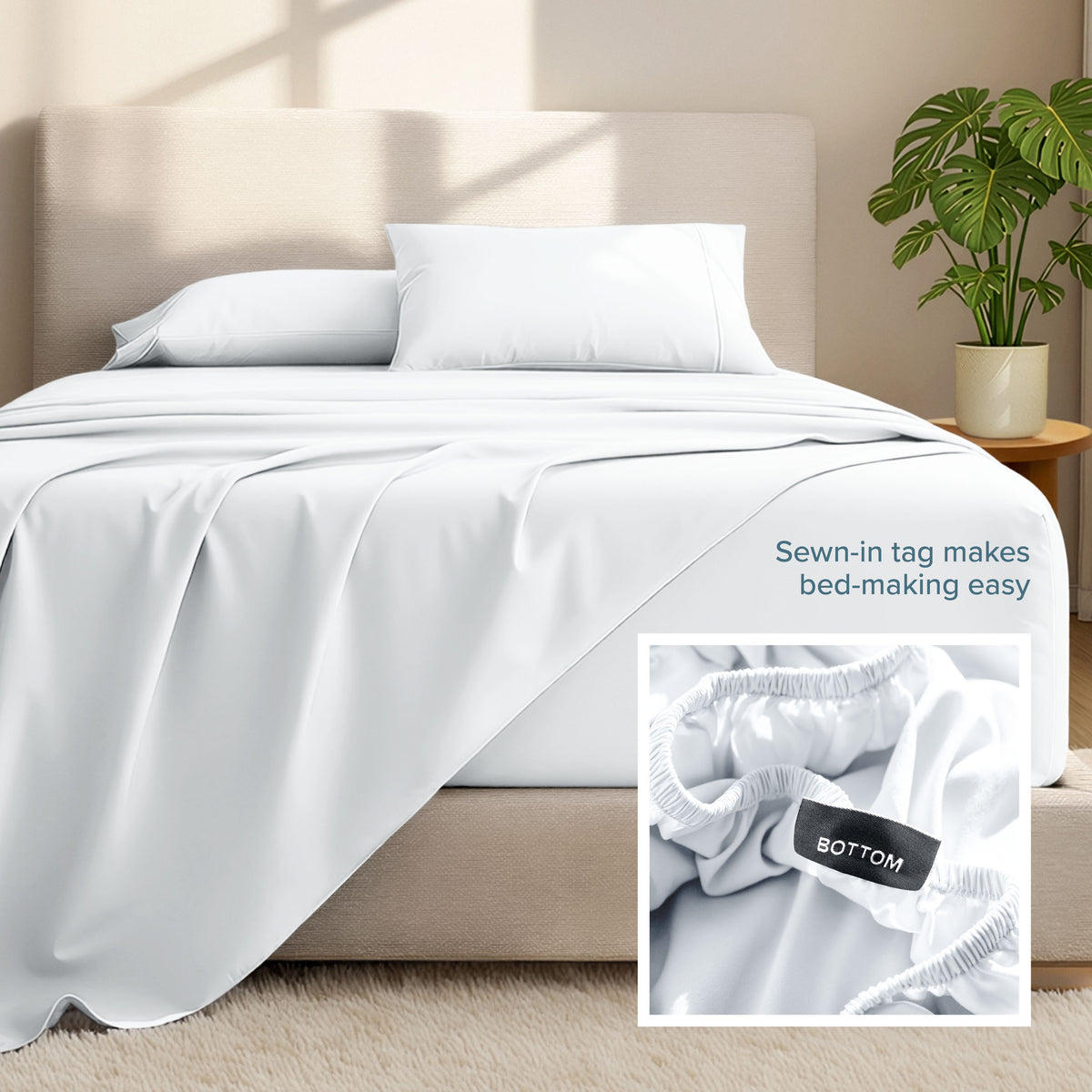 Bed sheets and pillows on a bed with a plant in the background