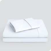 Microfiber sheet set folded and stacked neatly.