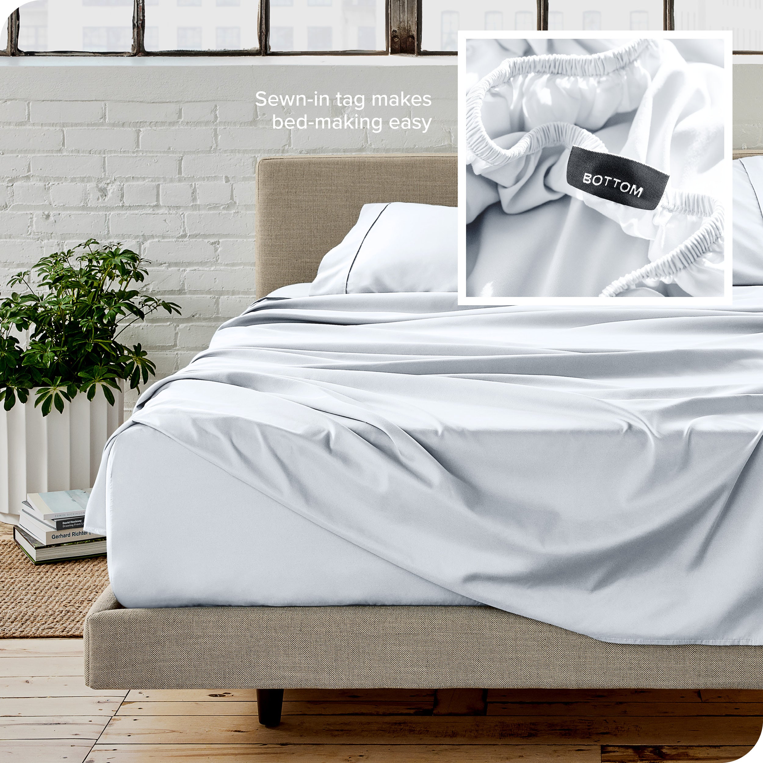 Close up of sewn in tag and matching sheets on a bed