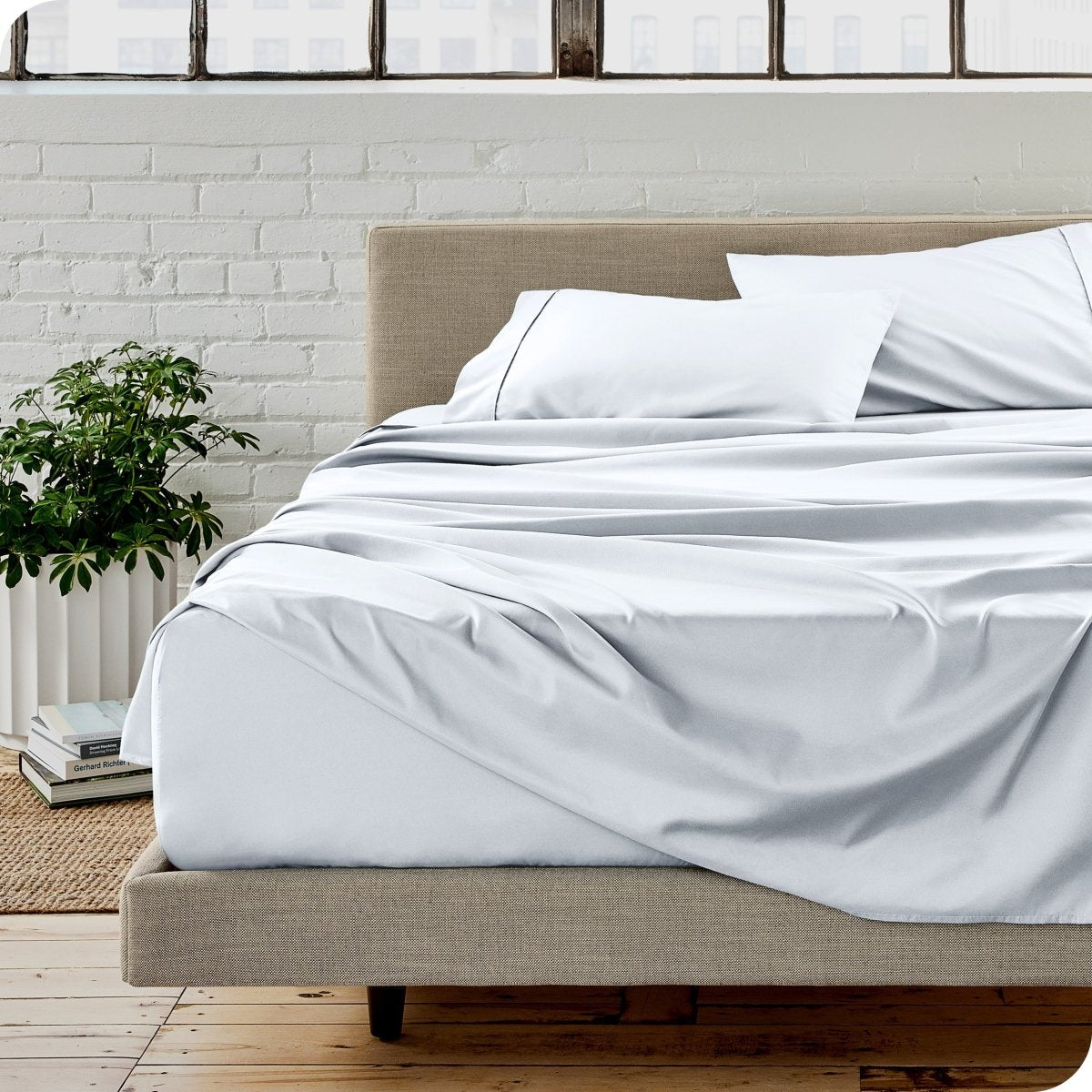 A modern bedroom with microfiber sheets on the mattress