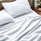 Close up of ultra-soft sheets on a bed
