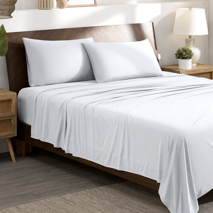Bed sheets and pillows on a bed in a bedroom setting.