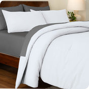 An angled view of a comforter set on a bed