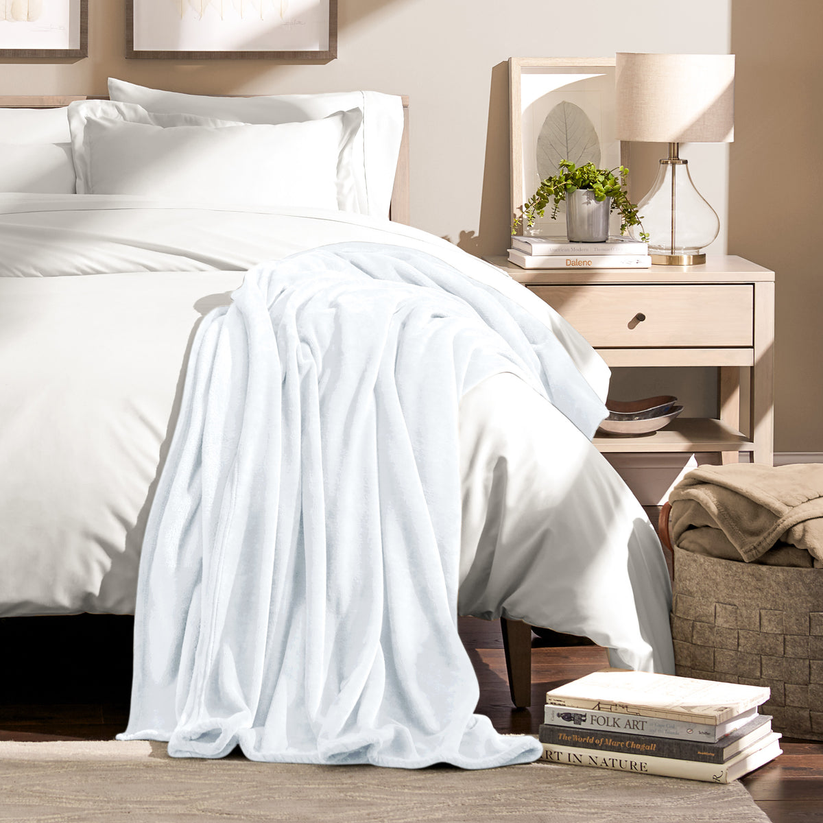 Microplush blanket draped over the corner of a bed