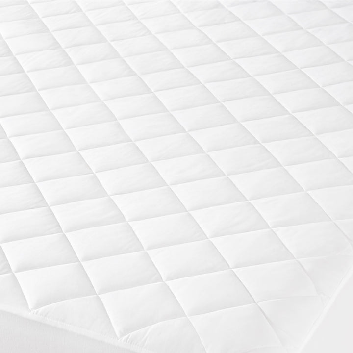 Close up of a quilted mattress pad