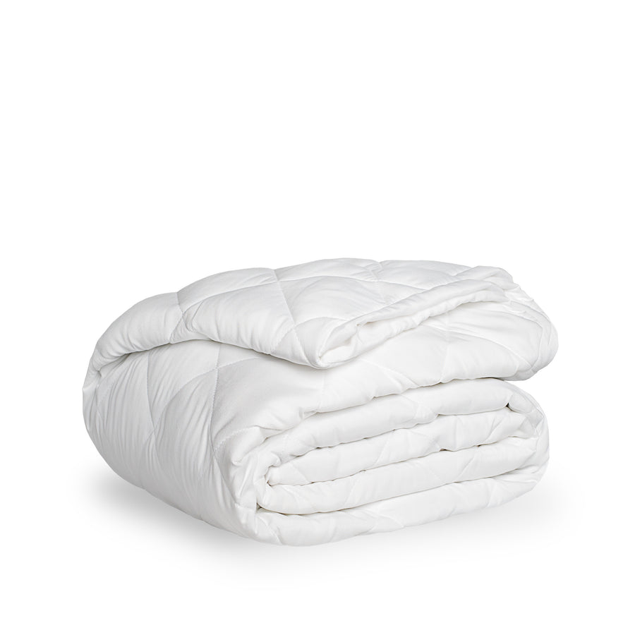 A white quilted mattress pad